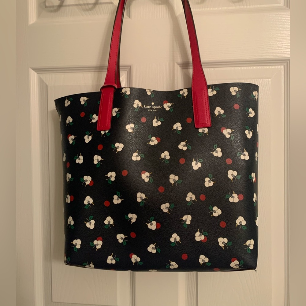 Reversible Kate Spade tote with wristlet.